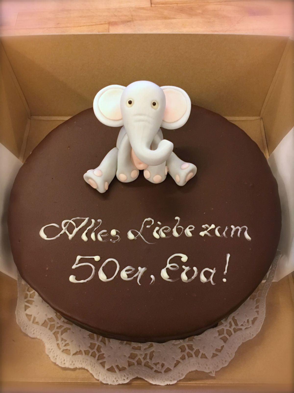 Dark chocolate cake with white fondant elephant for age 50
