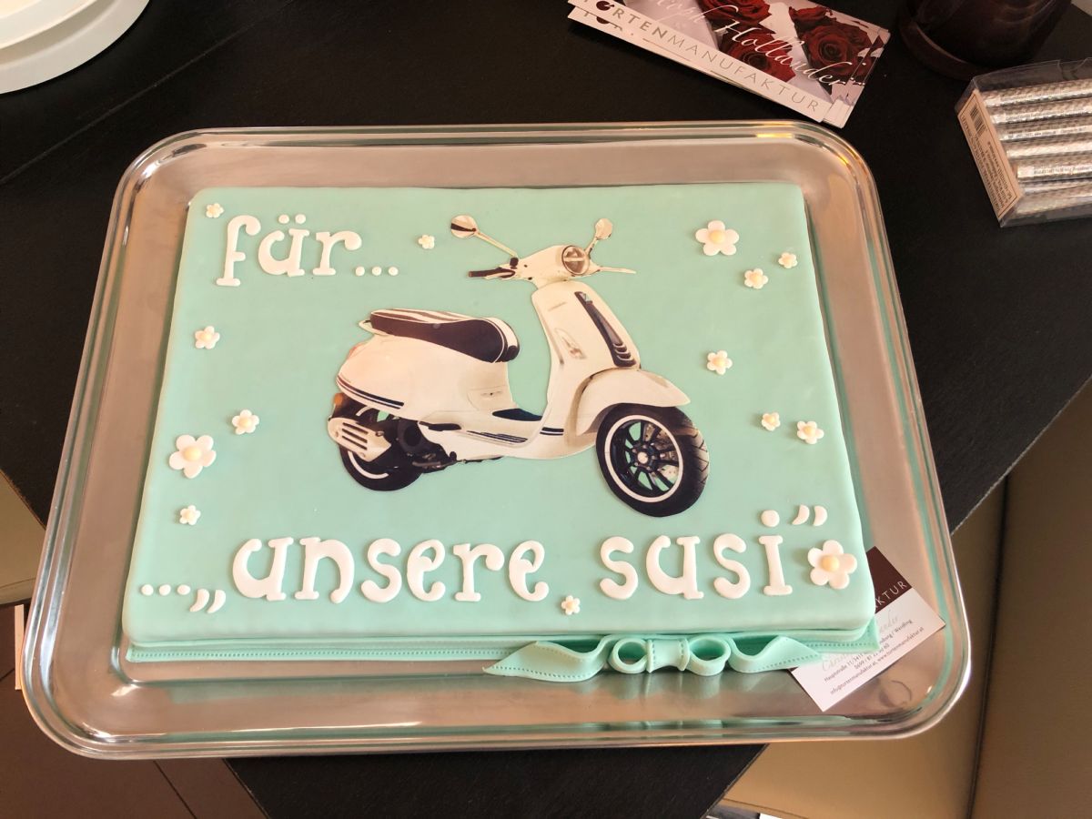 Rectangular mint-green cake with Vespa scooter and fondant flowers