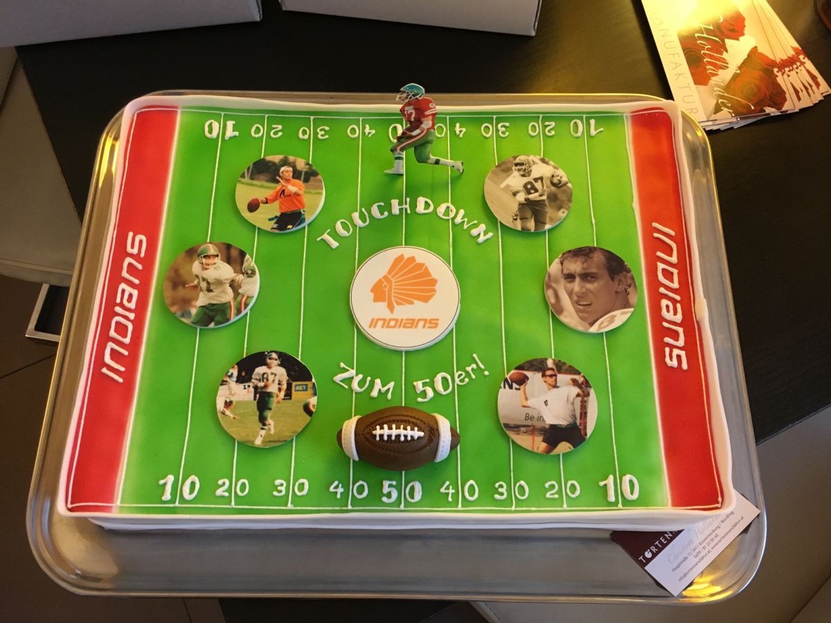 50th birthday cake designed as a football pitch with team colours and photo decorations