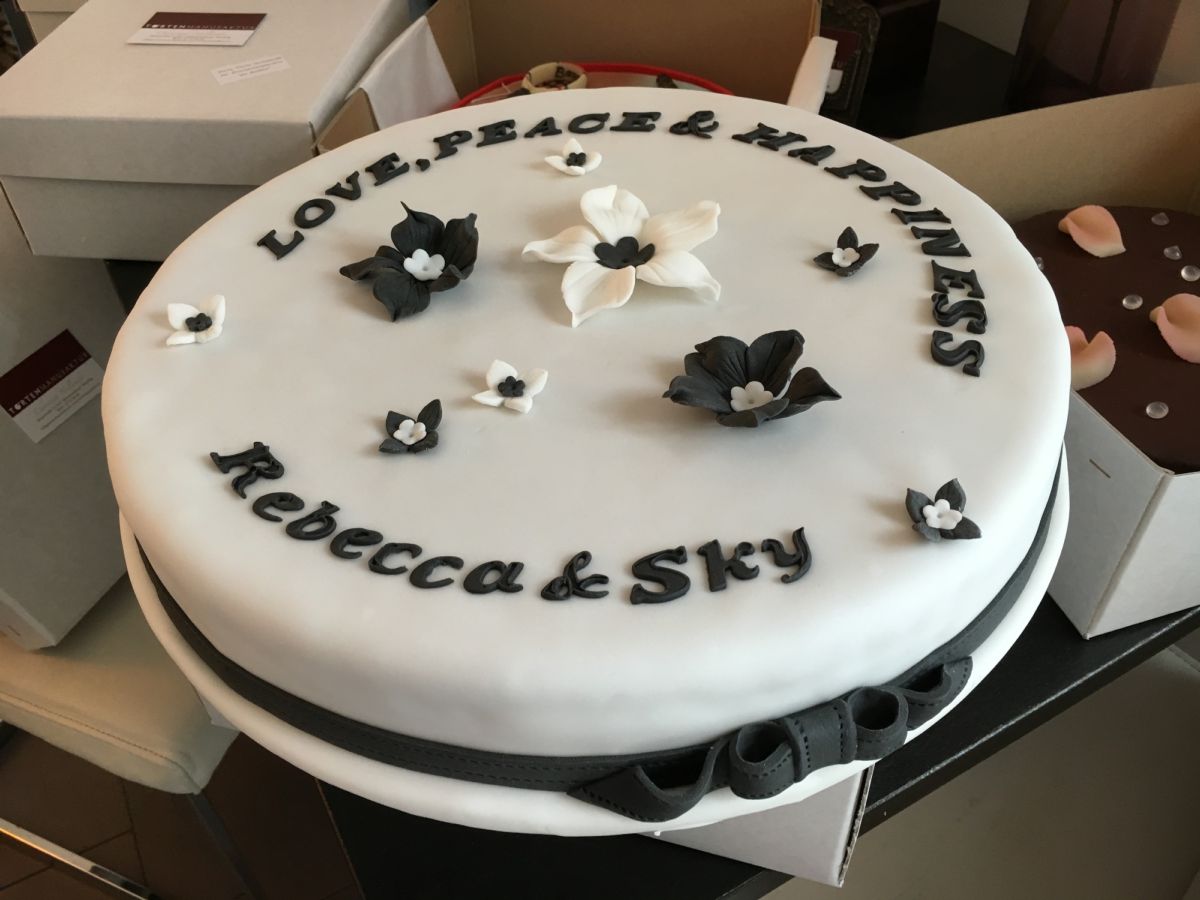 Round white cake with black and white fondant flowers