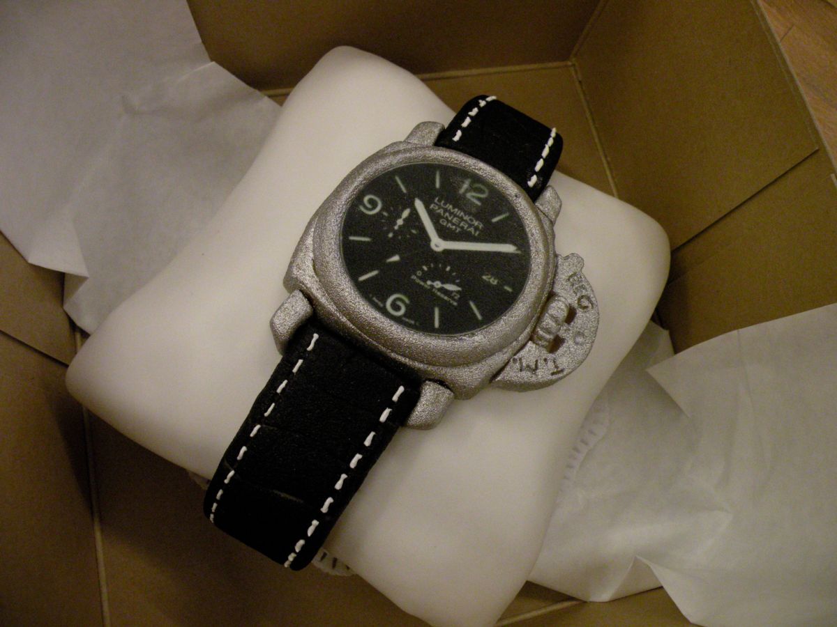Wristwatch cake with black leather strap and silver case