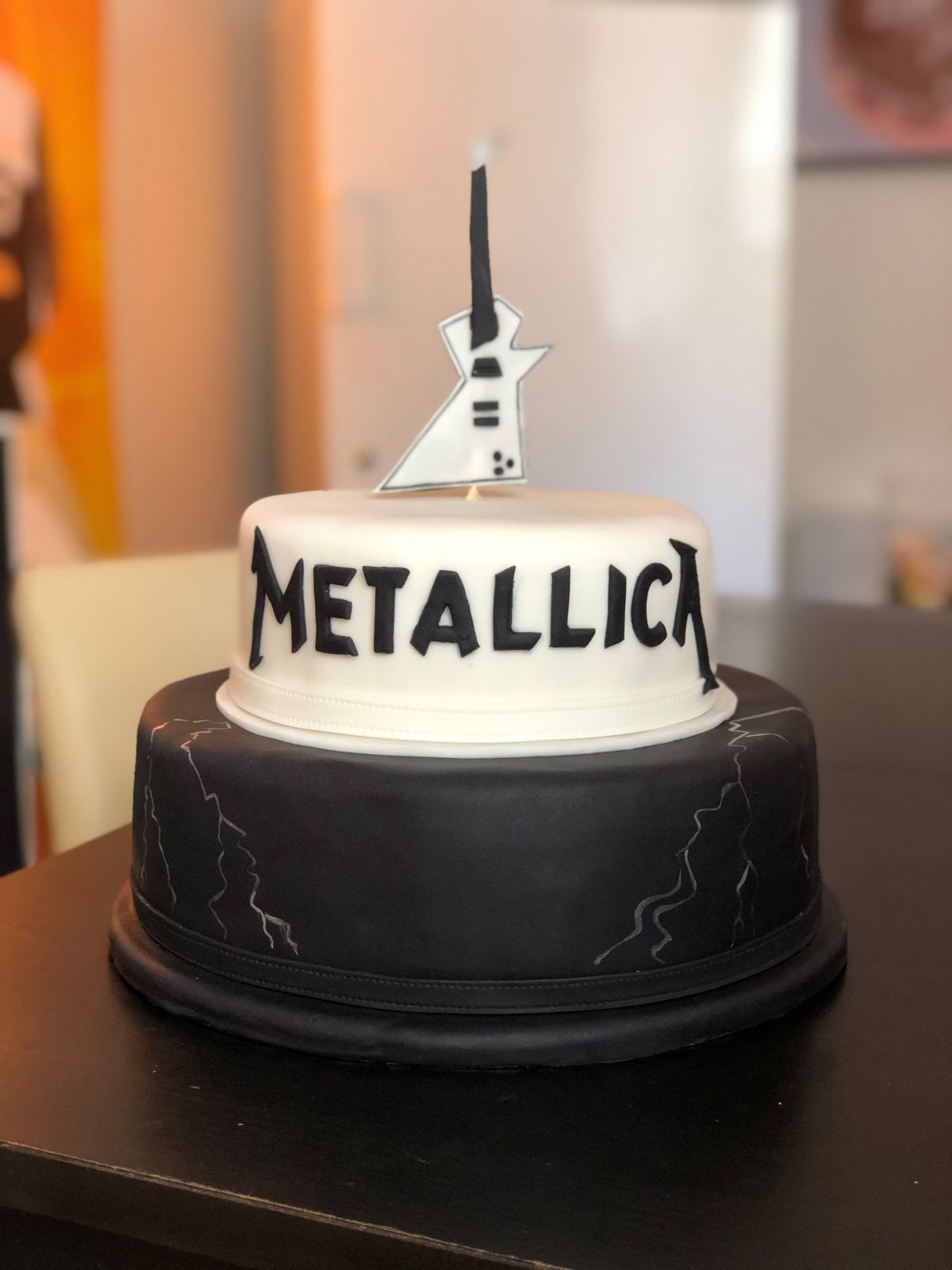 Heavy metal cake with electric guitar and lightning design