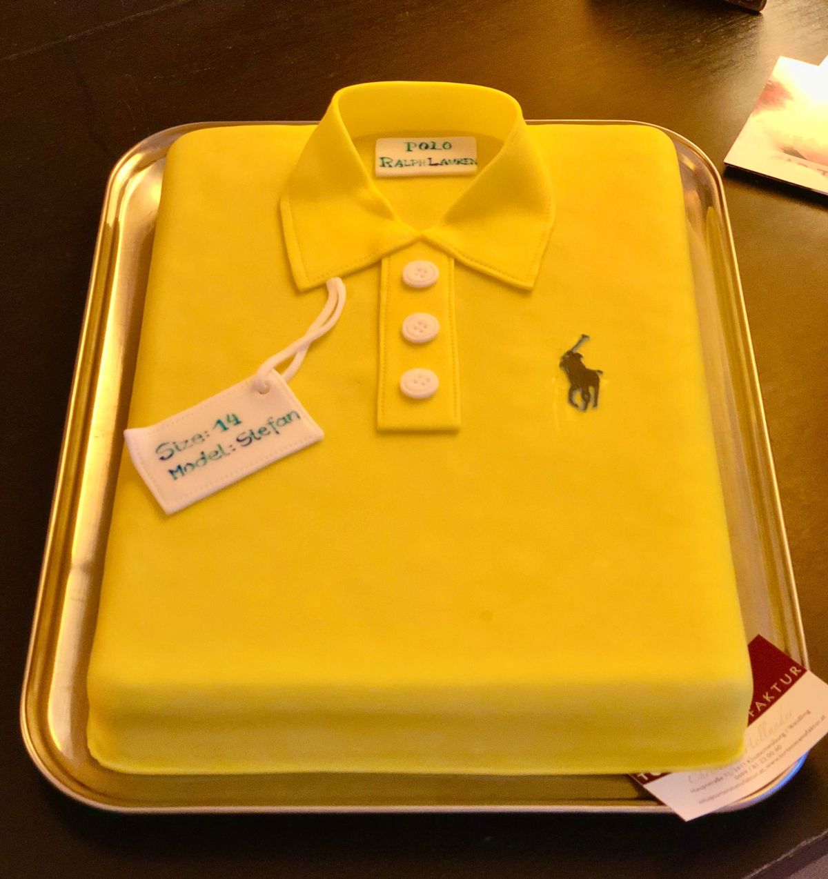Designer polo shirt cake in yellow with brand emblem