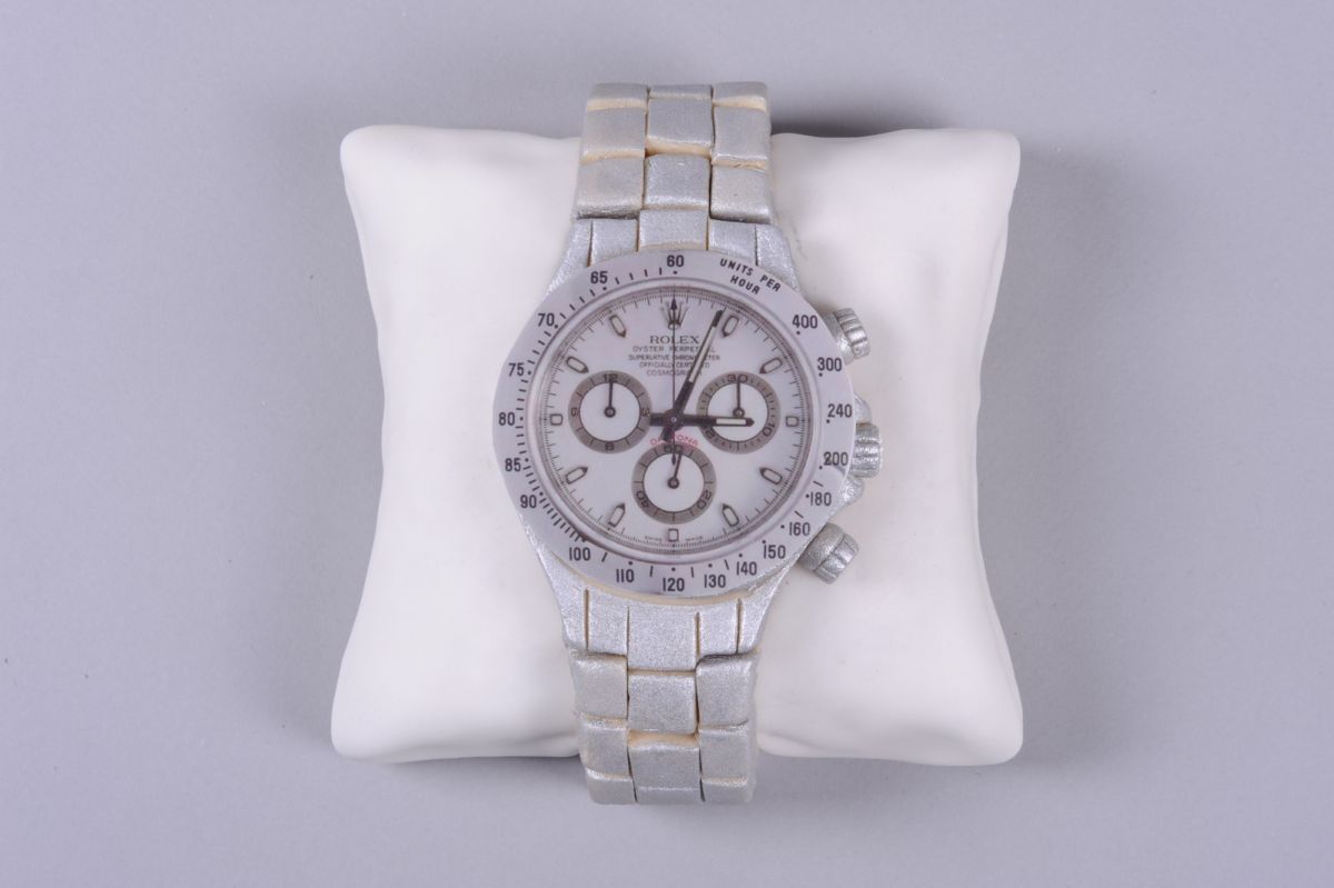 Luxury sports watch cake in silver and white with chronograph subdials on cushion