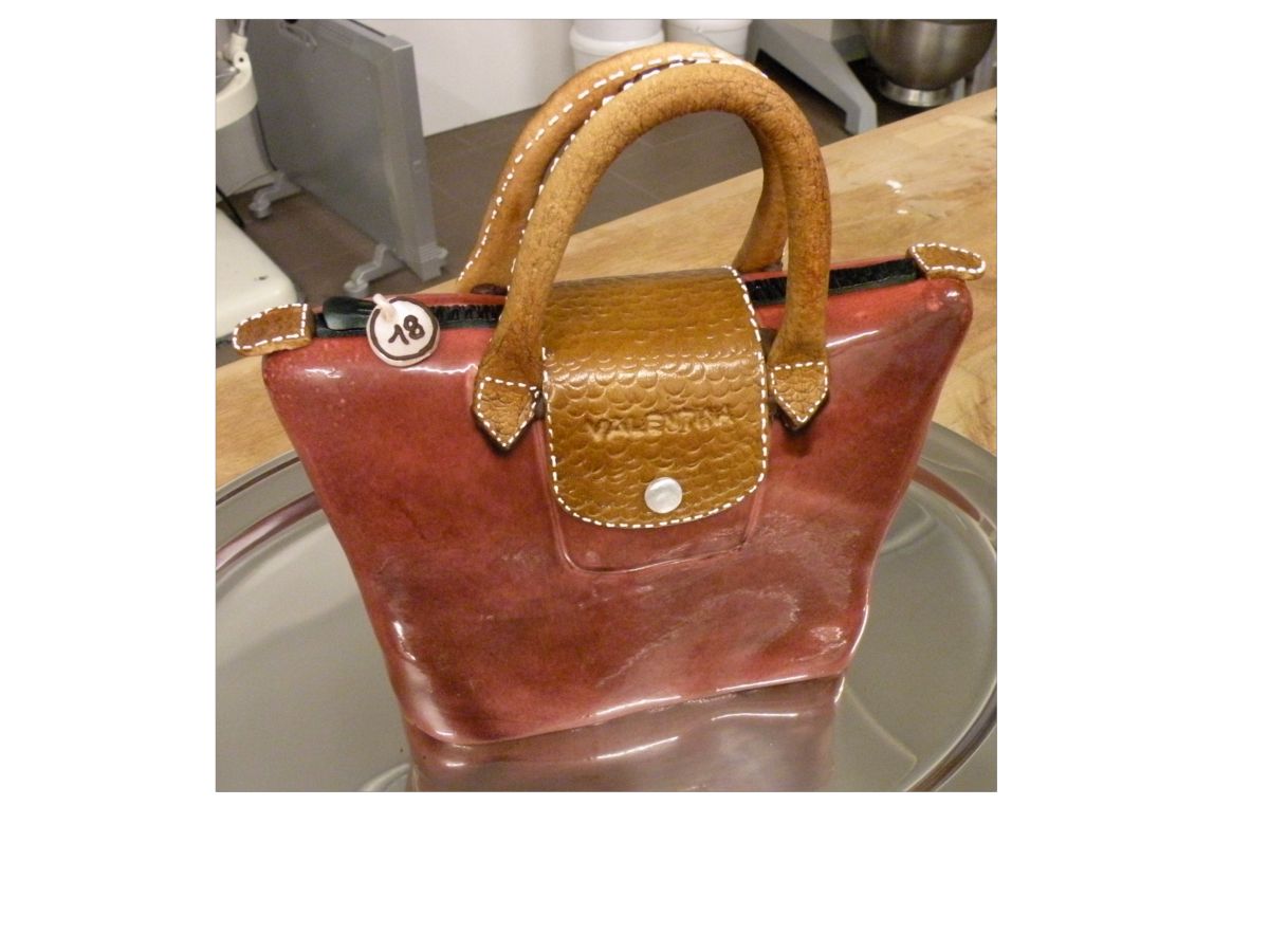 Red fondant handbag from the front with visible handle